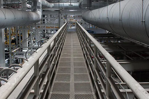 industrial walkway between ventilation pipes