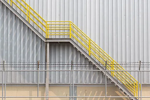 outdoor access ladder at factory building